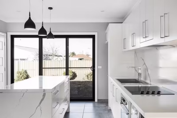 granny-flat-sydney-kitchen-design-natural-bench-carrara-pendant-lights-waterfall-bench-shadow-line-40mm-quality-island