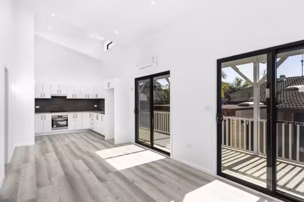 Granny-flat-sydney-open-plan-living-entertaing-patio-area-raked-ceiling-black-sliding-door