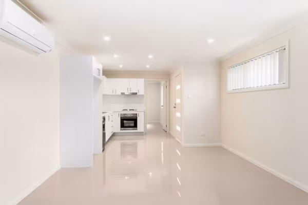 granny-flat-design-gloss-tiles-white-kitchen-hume-doors-design