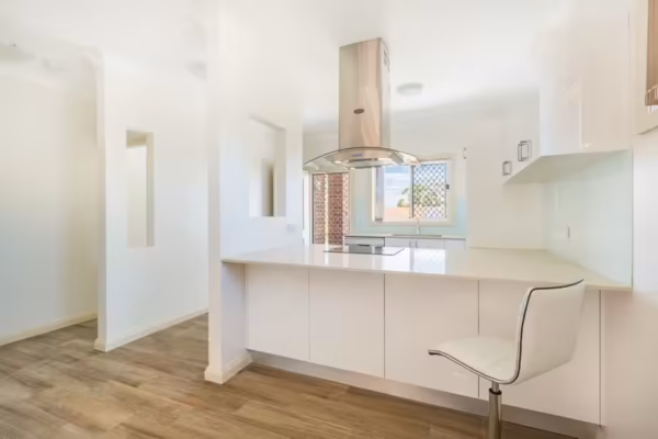 granny-flat-kitchen-sydney-design-stone-benchtop-beko-glass-splashback-polyurethane-fingerpull-shylight
