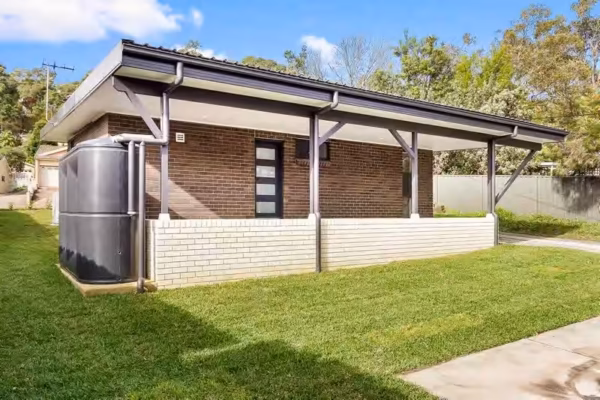 granny-flat-sydney-design-white-bricks-black-monument-watertank-back-door-rear-access