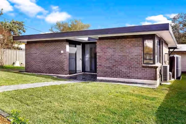 granny-flat-sydney-special-unique-design-corner-window-black-white-bricks-flat-colorbond-roof-monument-watertank-street-view-2bedrooms